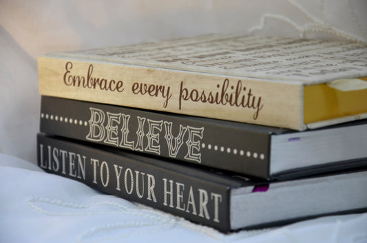 A stack of inspirational journals.