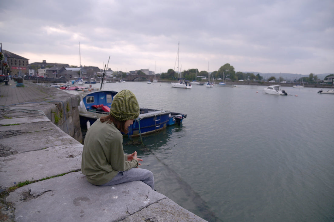 My Son sitting on a dock in Ireland